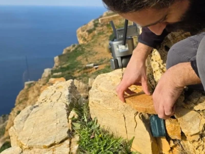 Here a camera and a bioacoustic device are being installed for the recording of birds and bats.